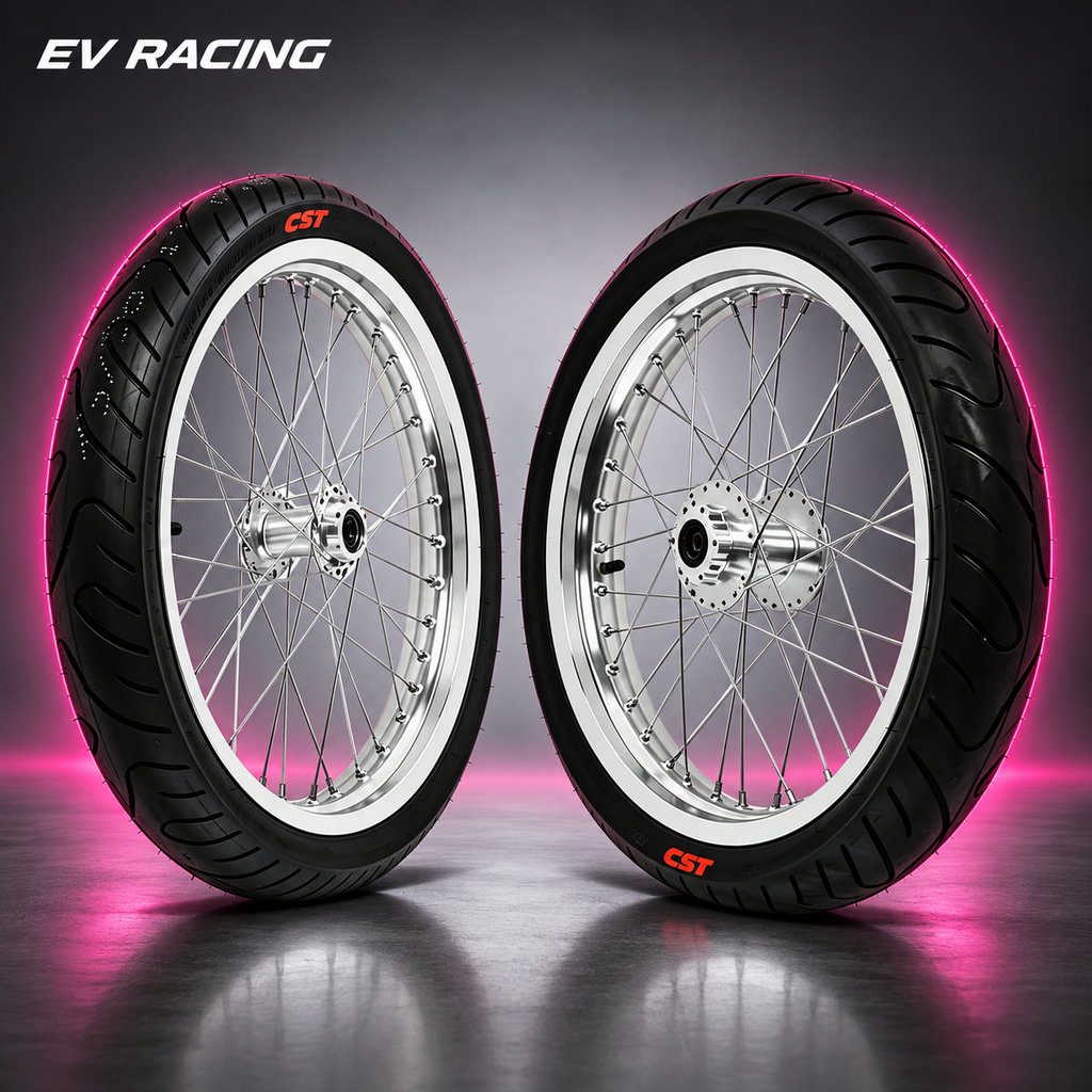 Chrome 17-inch supermoto wheel and tire pair on a gray studio background with pink accent lighting